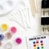 Mixify Beauty DIY kit components - spoons, palette, colors in container, uncolored nail polish