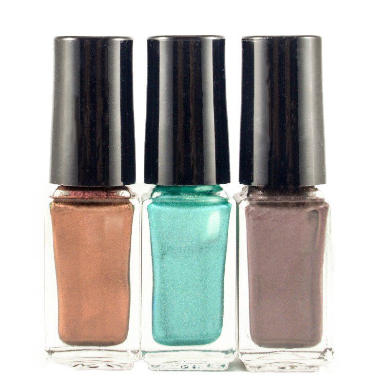 One bronze, one turquoise, one purple bottle of Mixify Beauty custom made nail polish